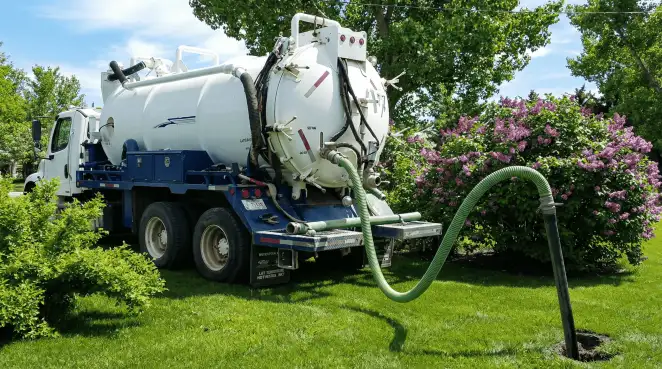 Professional vacuum truck performing residential drainage and septic maintenance in Albany, NY